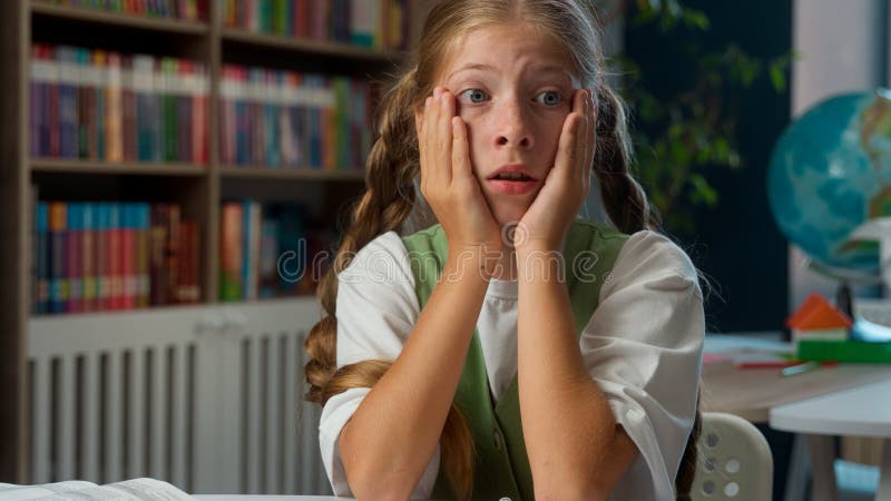 A child reading a book with focus and confidence